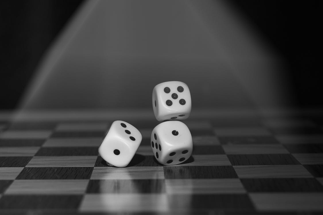 Three dice on a board