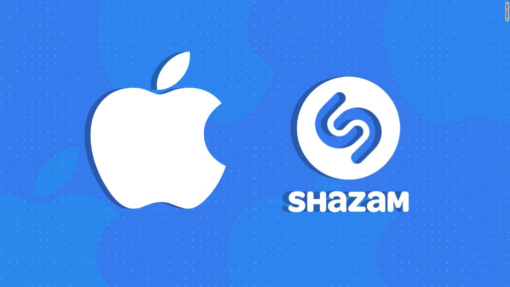Shazam logo facing Apple logo on blue background