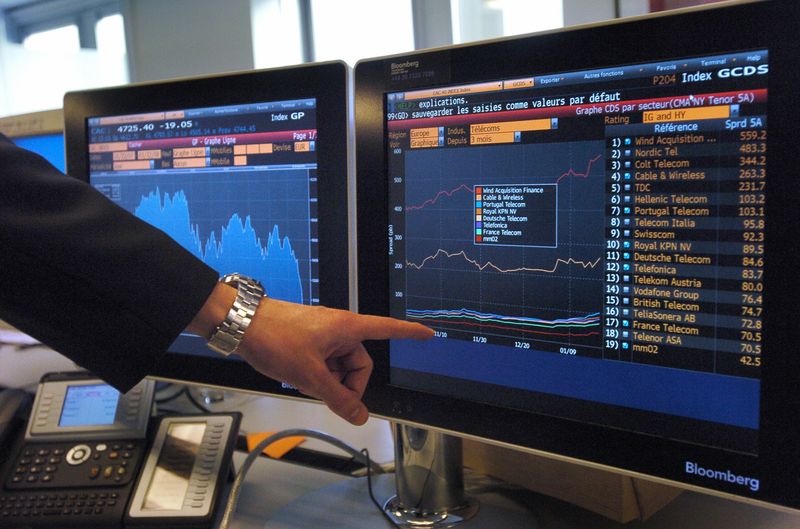 Man showing bond spread on a double monitor screen